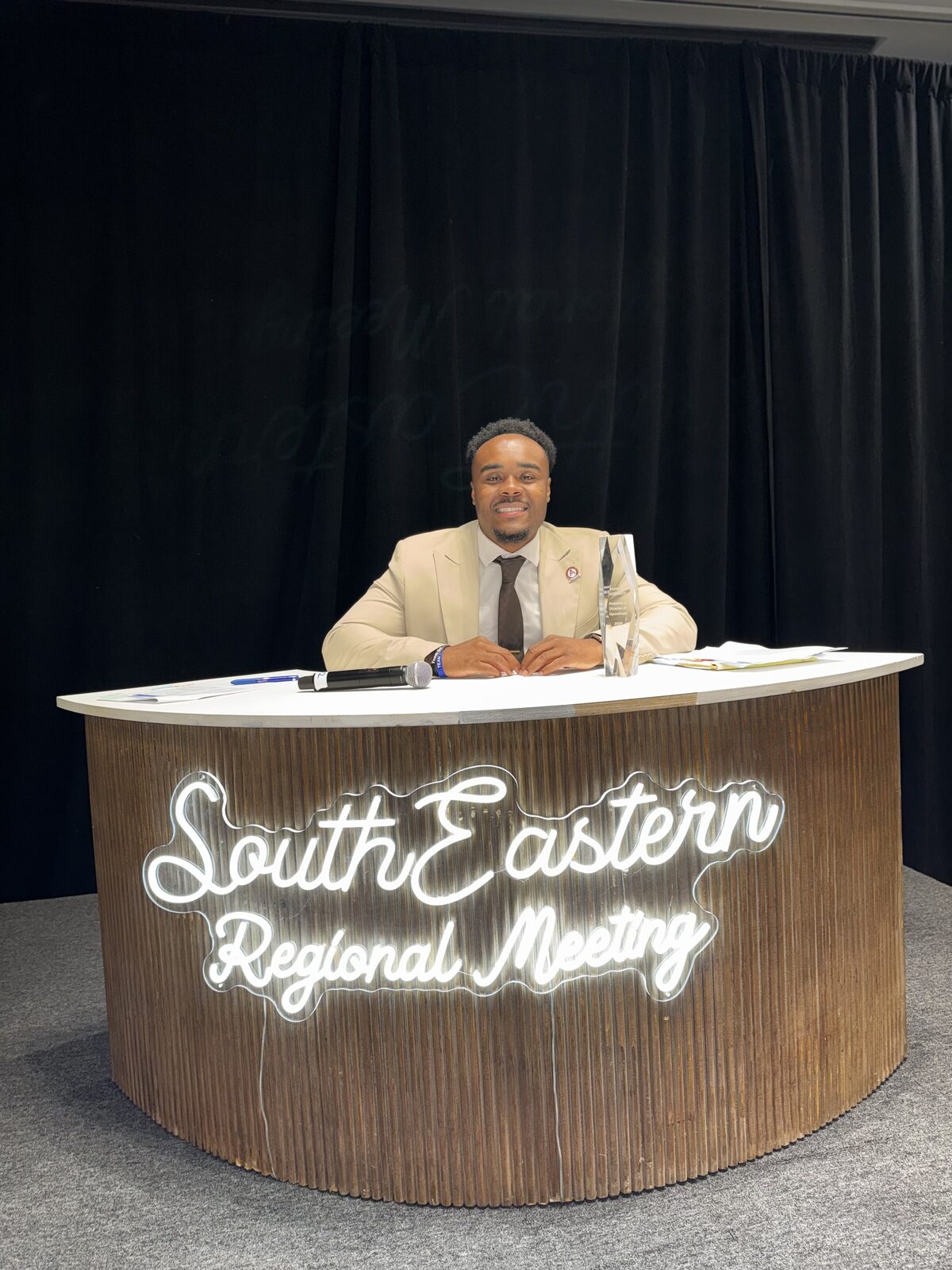 Noble Impact Marketing leader with an award at a South Eastern Regional Meeting