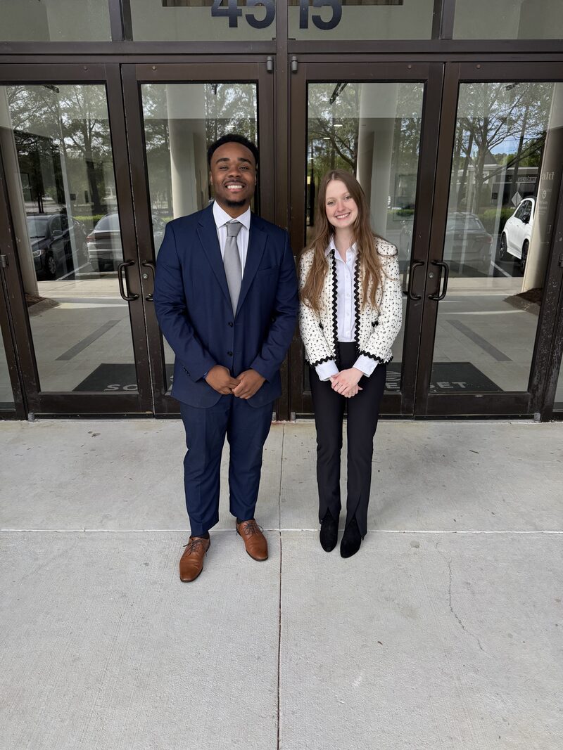 Two Noble Impact Marketing representatives ready to meet customers